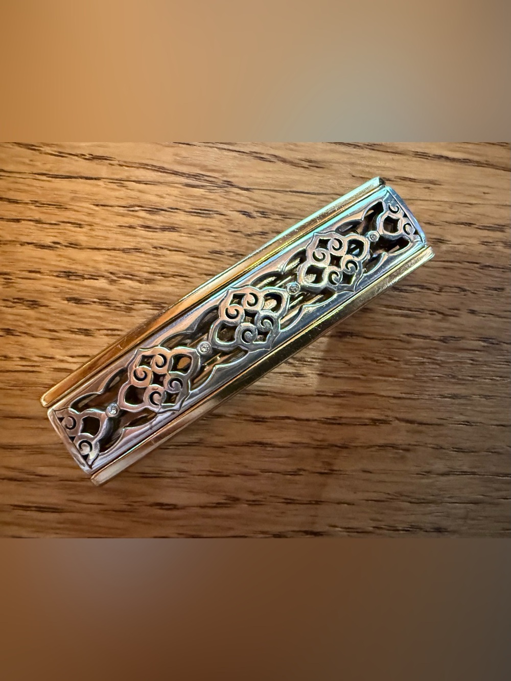 Brighton Small Barrette with silver-plated scrollwork and golden colored borders